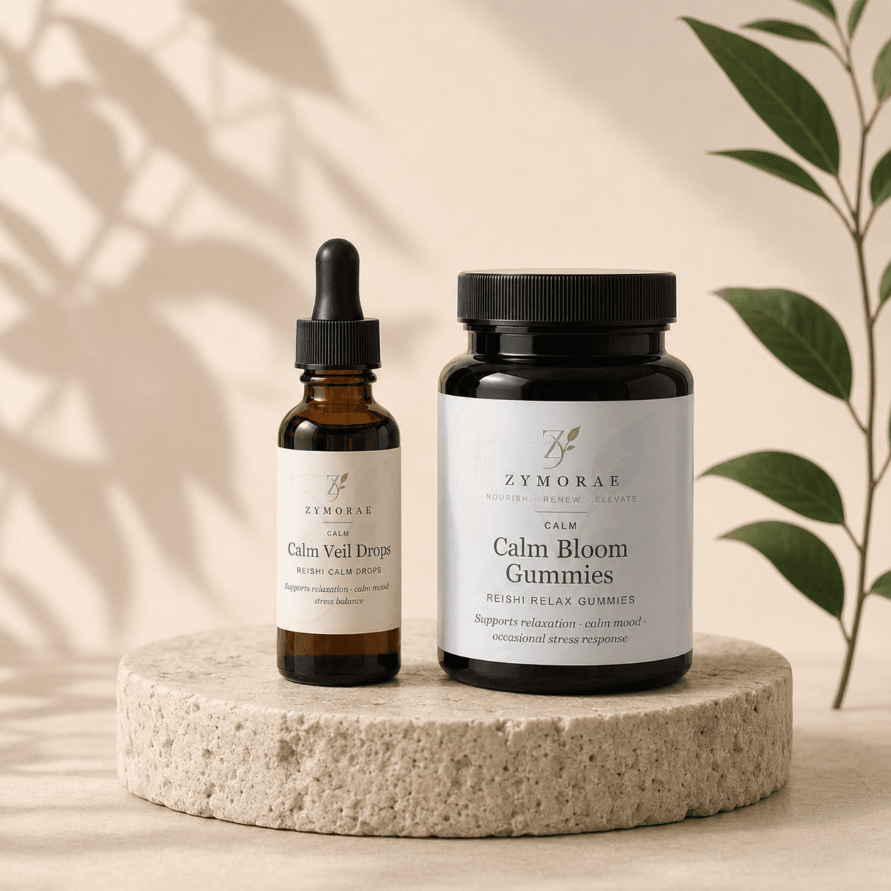 ZYMORAE Calm Veil Drops and Calm Bloom Gummies on travertine stone